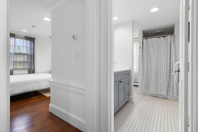 bathroom featuring a shower with curtain, crown molding, vanity, and wood-type flooring