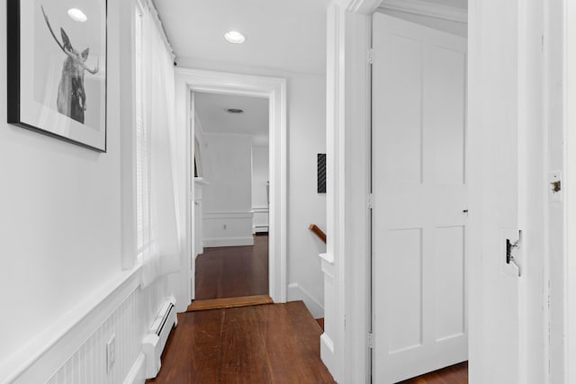 hall featuring dark hardwood / wood-style flooring and baseboard heating