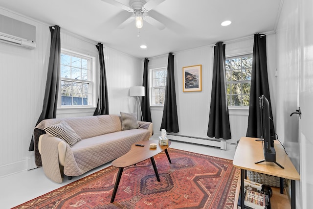 living room with a wall unit AC, baseboard heating, and ceiling fan