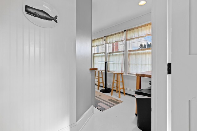 interior space with concrete flooring and a baseboard heating unit