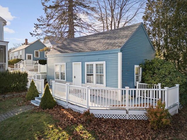 back of house featuring a deck