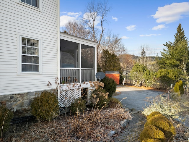 view of patio / terrace with a sunroom