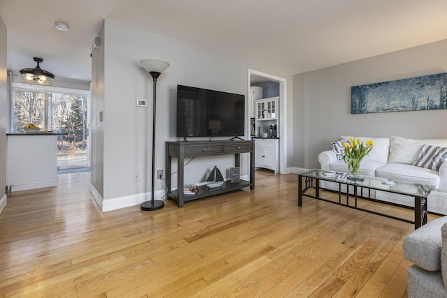 living room with light hardwood / wood-style flooring