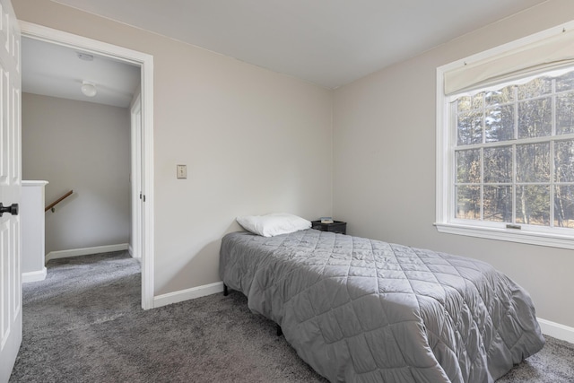 bedroom featuring dark carpet