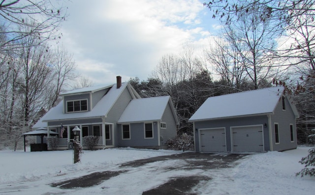 view of front facade featuring a porch and a garage