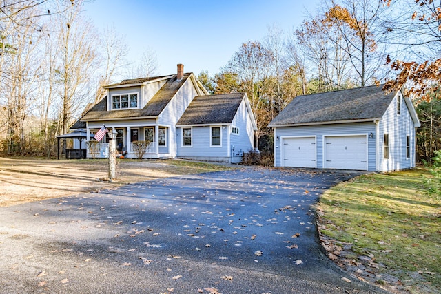 view of front of home with an outbuilding and a garage