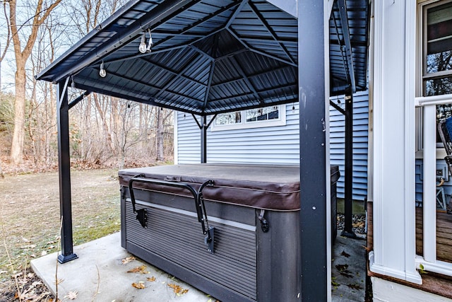 view of patio / terrace with a hot tub