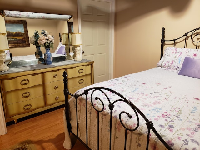 bedroom with wood-type flooring