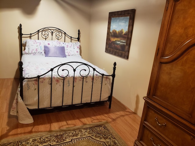 bedroom with light wood-type flooring