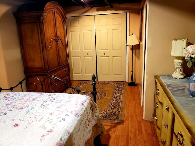 bedroom featuring light hardwood / wood-style flooring and a closet