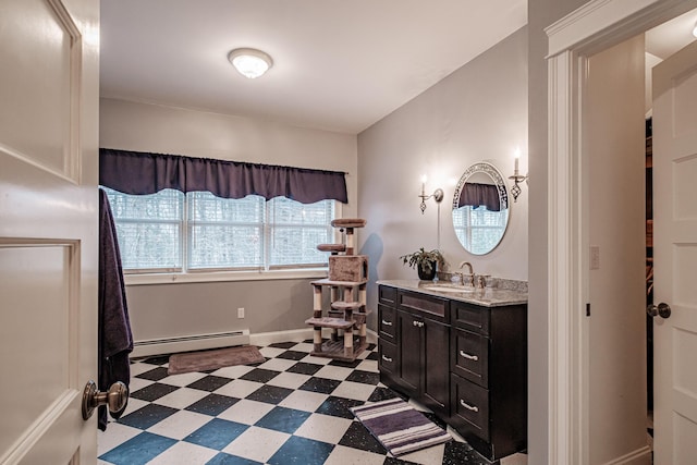 bathroom featuring vanity and a baseboard heating unit