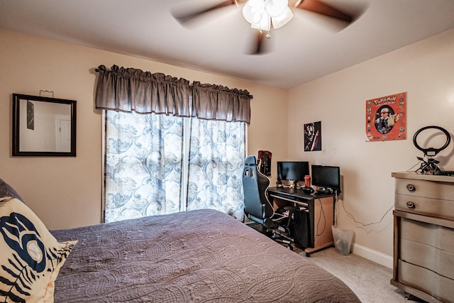 bedroom with ceiling fan and light carpet