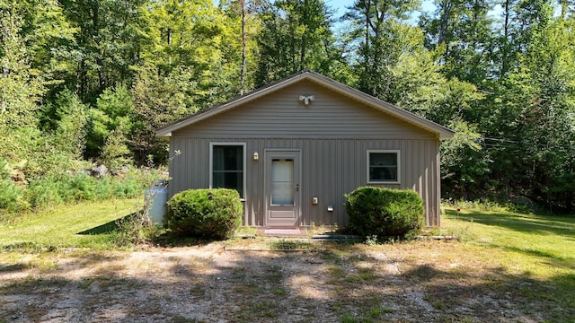 view of outdoor structure with a lawn