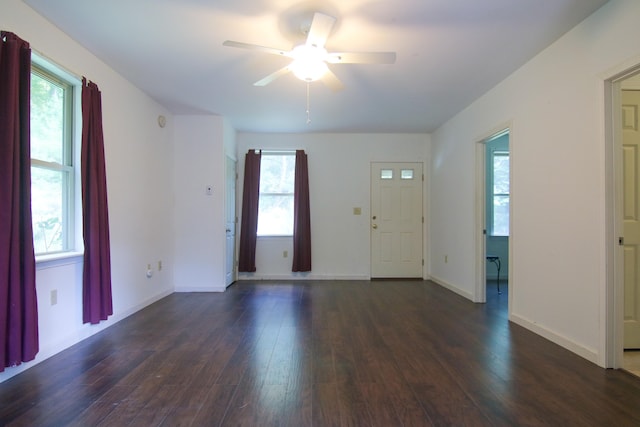 entryway with ceiling fan and dark wood-type flooring