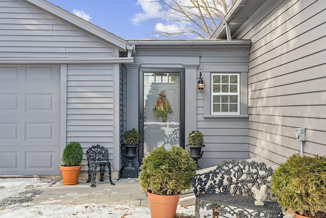 entrance to property featuring a garage