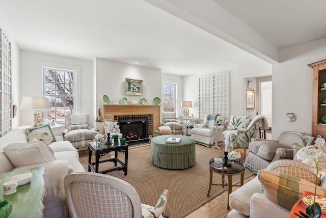 living room with light wood-type flooring and plenty of natural light