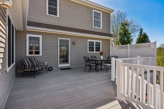 wooden deck with outdoor dining space