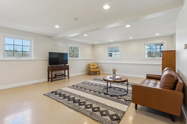 living room with baseboards, recessed lighting, beam ceiling, and finished concrete floors