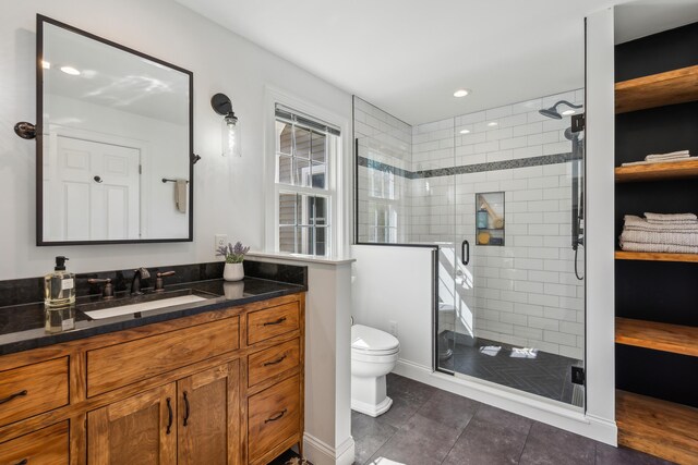 full bath featuring vanity, toilet, recessed lighting, tile patterned floors, and a shower stall