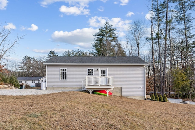 back of house with a yard