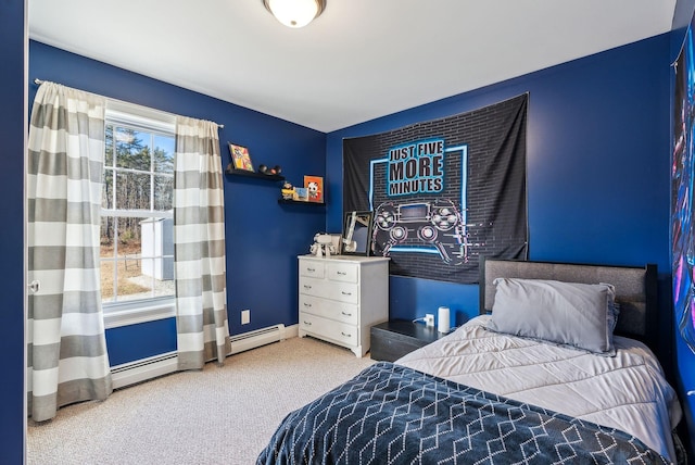 bedroom with carpet flooring and a baseboard heating unit