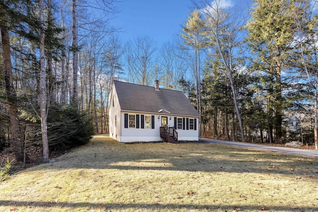 new england style home featuring a front yard