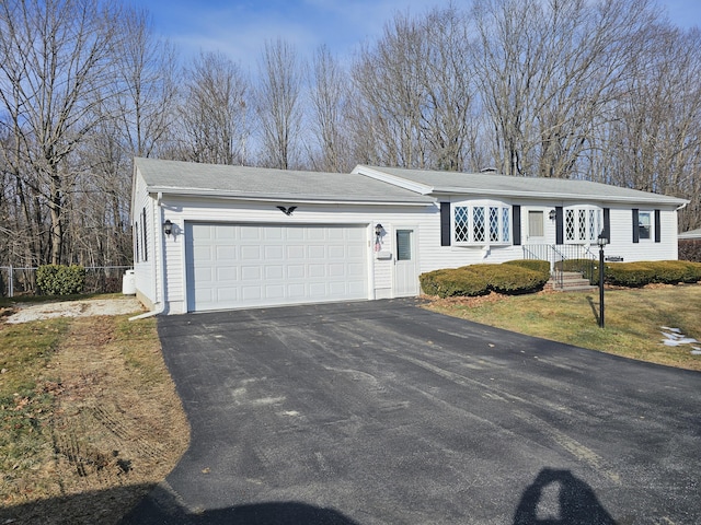 single story home with a garage