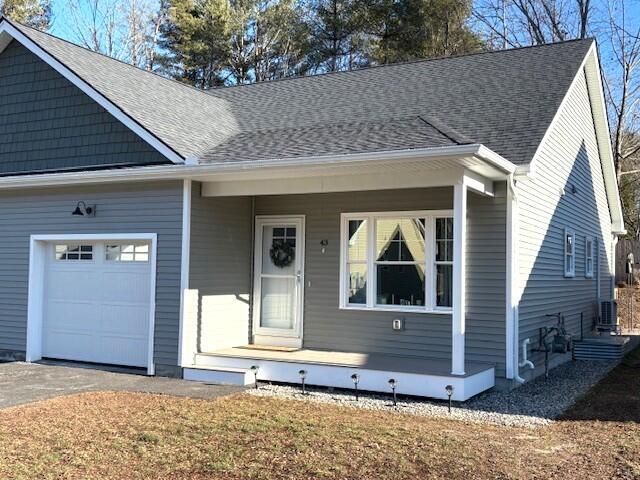 view of front of house featuring covered porch and a garage