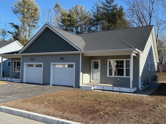 view of front of home with covered porch and a garage