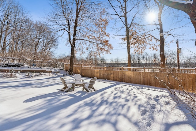 view of yard layered in snow