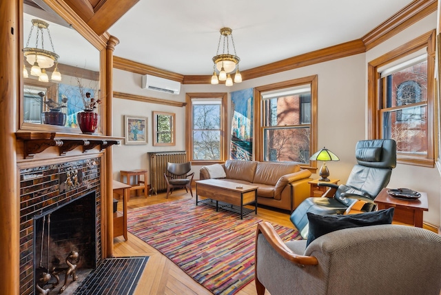 living room featuring a brick fireplace, ornamental molding, and a wall mounted AC