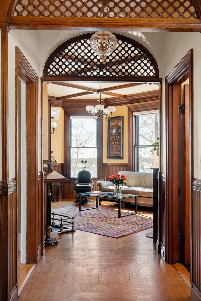 sitting room featuring ornamental molding and a chandelier