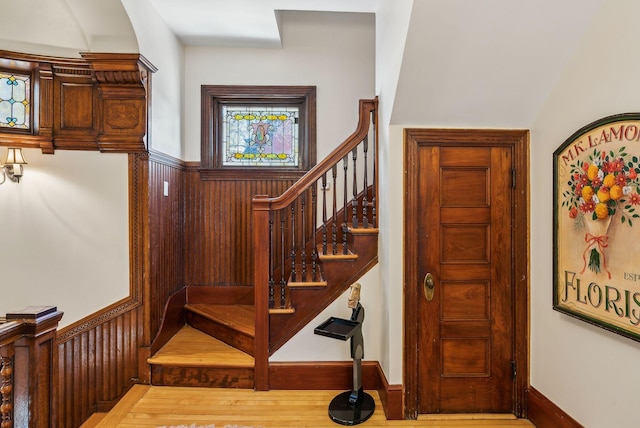 stairs featuring wood-type flooring