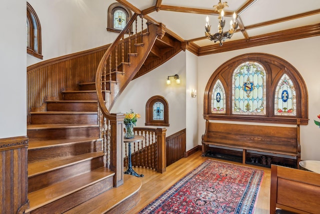 foyer with light wood-type flooring and a chandelier