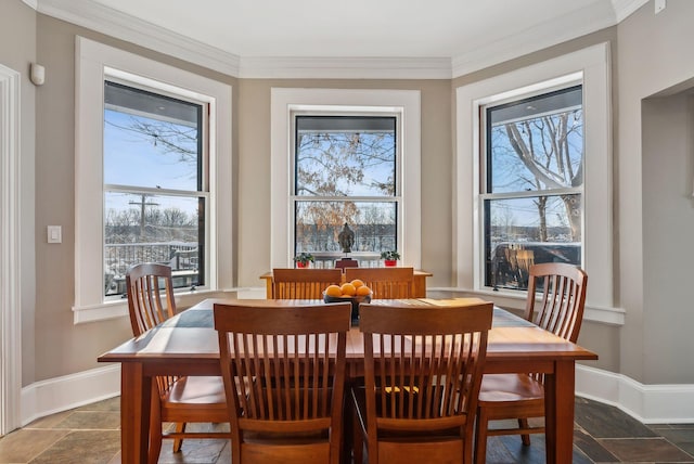 dining room featuring crown molding