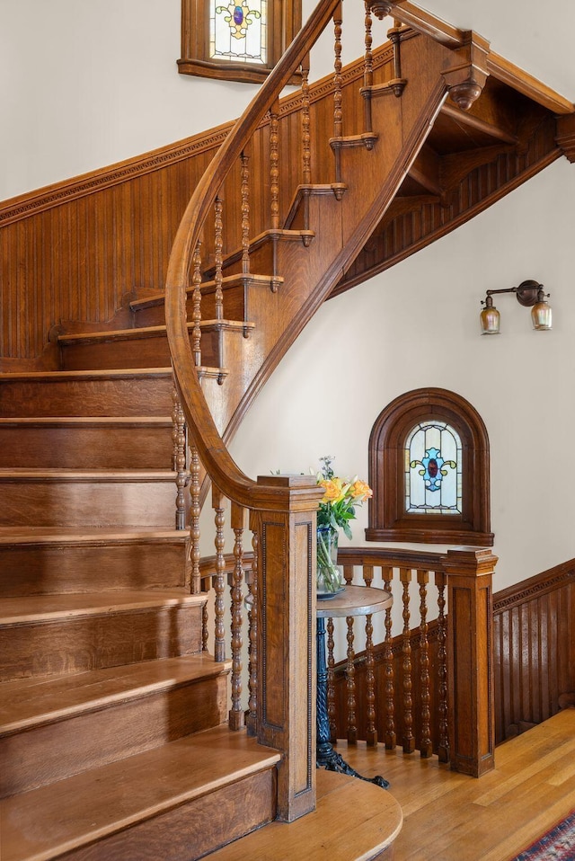 stairs with hardwood / wood-style floors