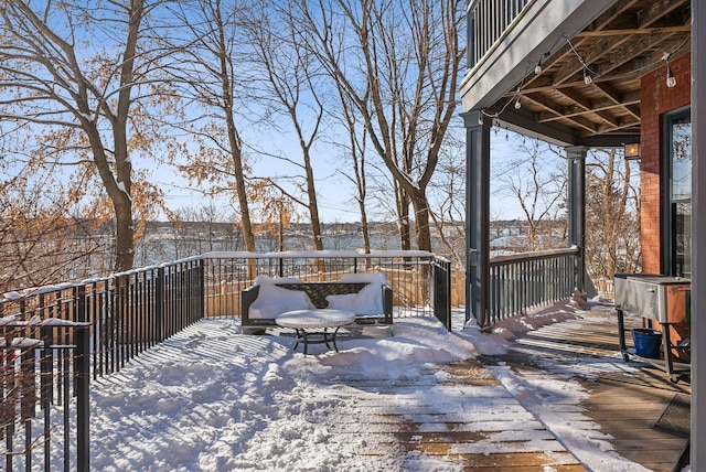 view of snow covered deck