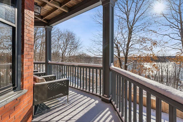 view of snow covered deck