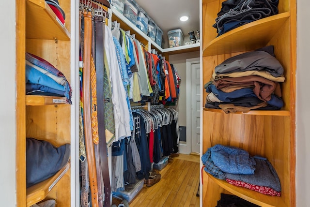 walk in closet featuring light hardwood / wood-style flooring