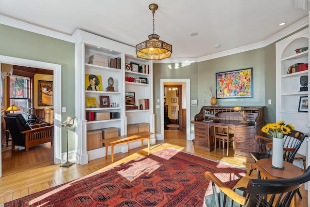 living area featuring built in features, light hardwood / wood-style flooring, and ornamental molding