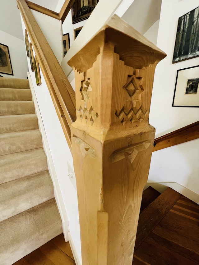 staircase featuring wood-type flooring