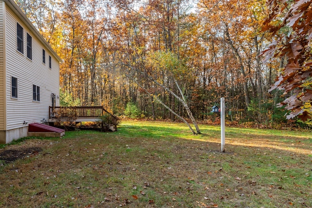 view of yard featuring a wooden deck