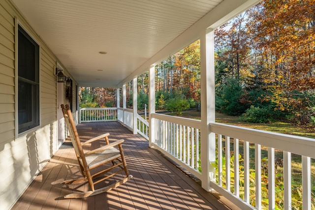 wooden terrace featuring covered porch