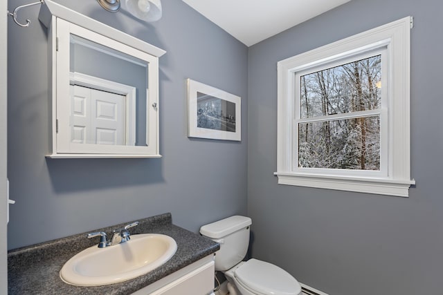 bathroom featuring toilet and vanity