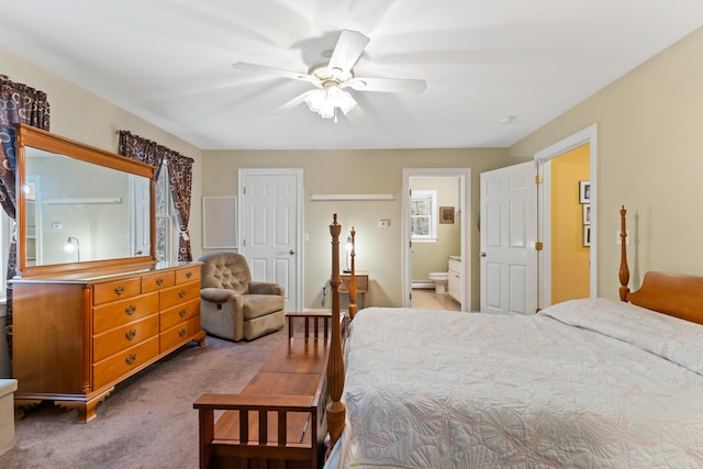 bedroom with a closet, ensuite bath, carpet floors, ceiling fan, and a baseboard radiator