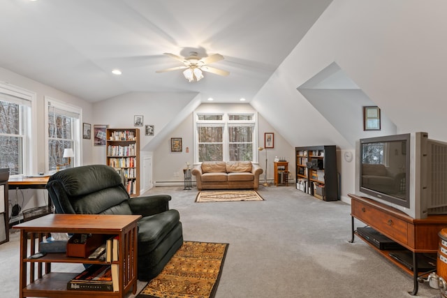 living room featuring lofted ceiling, baseboard heating, ceiling fan, and light carpet