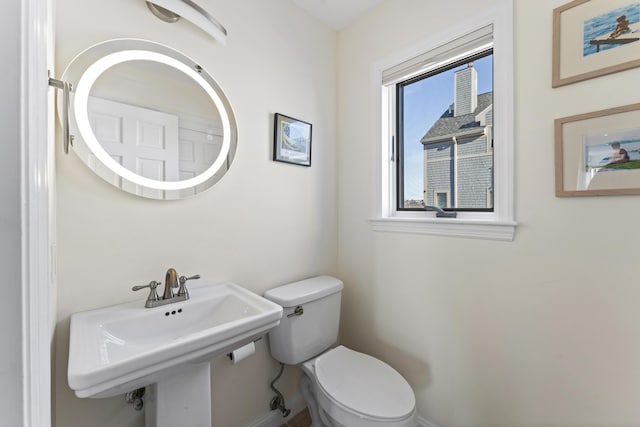 bathroom with sink and toilet