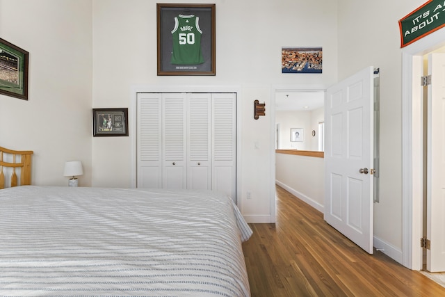 bedroom featuring dark hardwood / wood-style floors and a closet