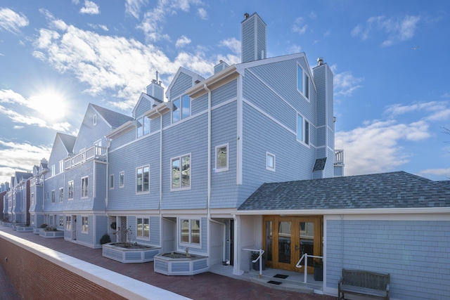 rear view of house featuring a balcony