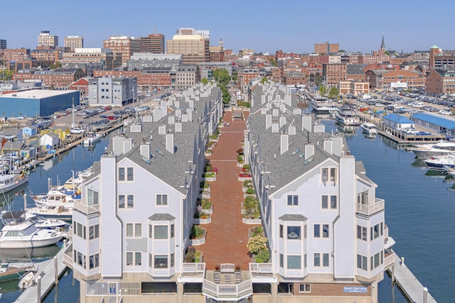 birds eye view of property with a water view